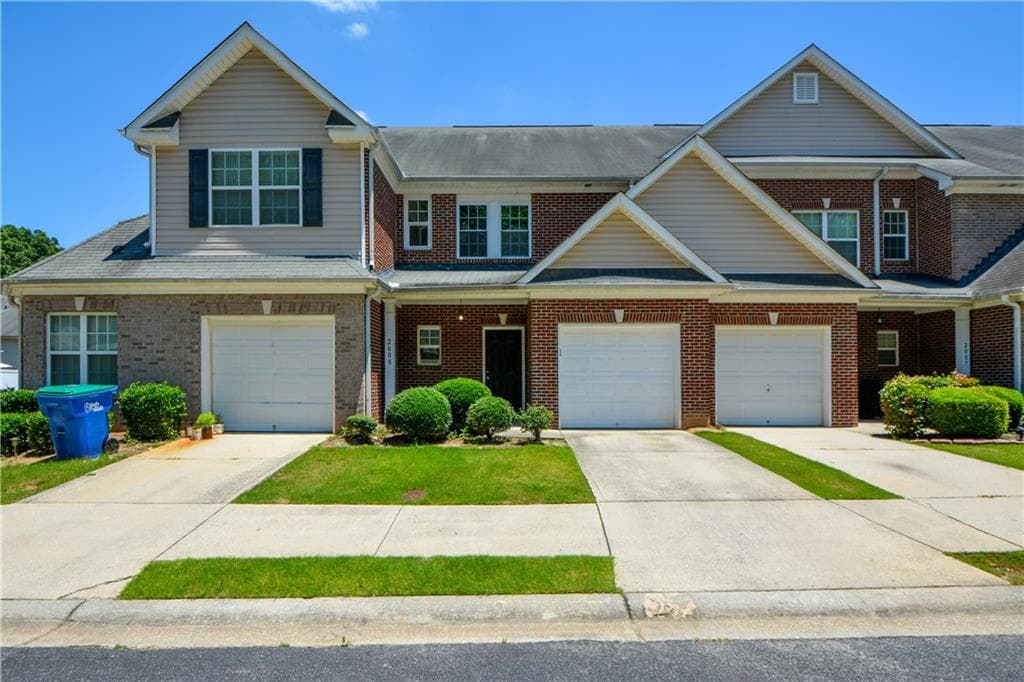 2 bedroom, 3 bathroom, 1,590 sq ft townhouse for sale at 2555 Flat Shoals Road 2008, Atlanta, GA 30349 — photo 1 of 33