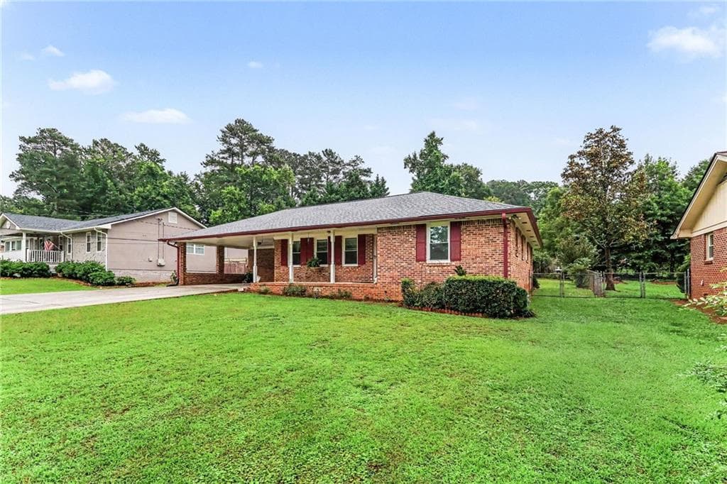 3 bedroom, 2 bathroom, 1,589 sq ft single family residence for sale at 3418 Lake Drive, Lawrenceville, GA 30044 — photo 2