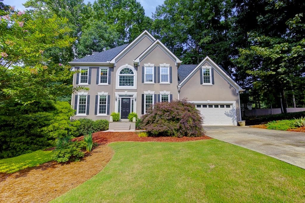 4 bedroom, 3 bathroom, 2,456 sq ft single family residence for sale at 4520 Wexford Court, Cumming, GA 30040 — photo 1 of 54