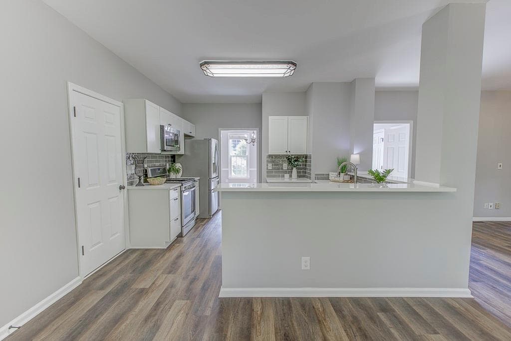 4 bedroom, 3 bathroom, 2,456 sq ft single family residence for sale at 4520 Wexford Court, Cumming, GA 30040 — photo 4
