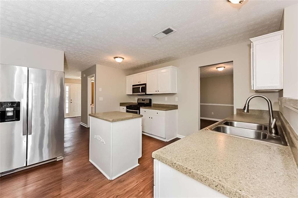 4 bedroom, 3 bathroom, 2,044 sq ft single family residence for sale at 3998 Peachtree Farms Road, Rex, GA 30273 — photo 7