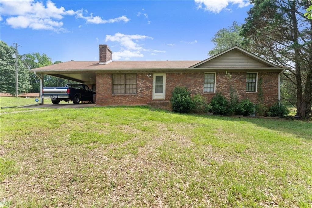 3 bedroom, 2 bathroom, 1,371 sq ft single family residence for sale at 5590 Howard Road, Cumming, GA 30040 — photo 1 of 32