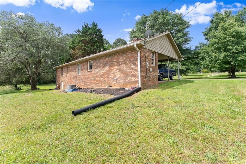 3 bedroom, 2 bathroom, 1,371 sq ft single family residence for sale at 5590 Howard Road, Cumming, GA 30040 — photo 7