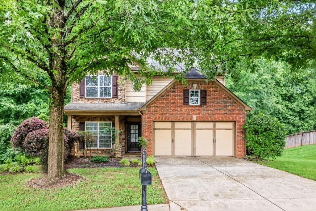 5 bedroom, 3 bathroom, 2,441 sq ft single family residence for sale at 4565 Evandale Way, Cumming, GA 30040 — photo 1 of 34