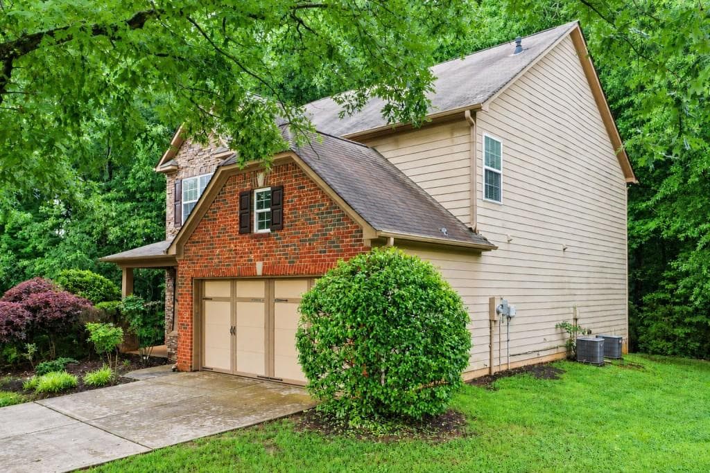 5 bedroom, 3 bathroom, 2,441 sq ft single family residence for sale at 4565 Evandale Way, Cumming, GA 30040 — photo 4