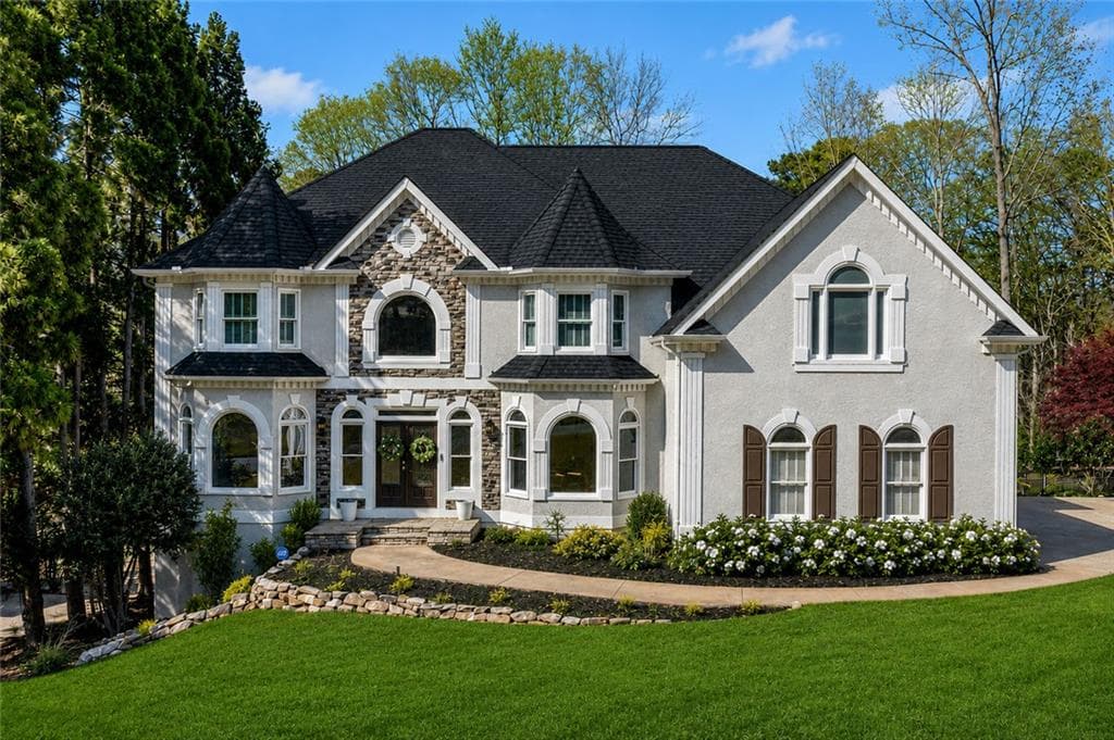 5 bedroom, 5 bathroom, 6,257 sq ft single family residence sold at 422 Lovinggood Landing Drive, Woodstock, GA 30189