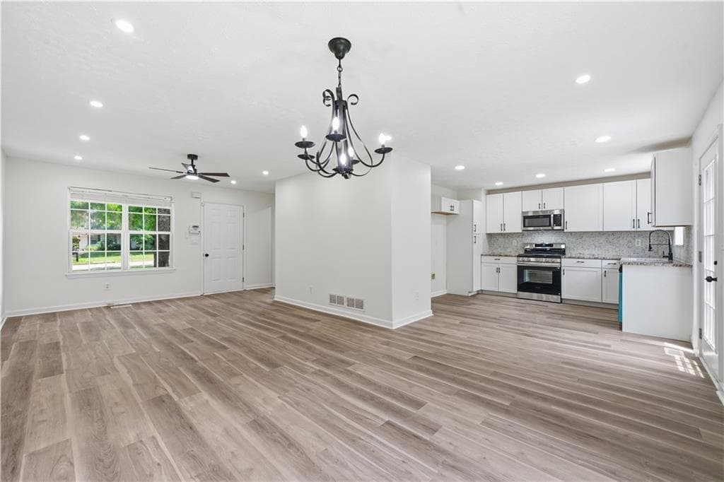 5 bedroom, 3 bathroom, 2,220 sq ft single family residence for sale at 483 Mephisto Circle, Lawrenceville, GA 30046 — photo 5