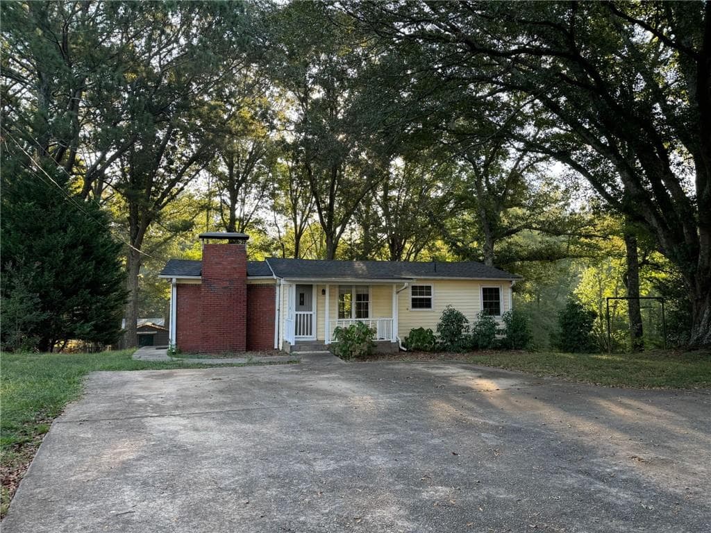 2 bedroom, 2 bathroom, 900 sq ft single family residence for sale at 14450 Cogburn Road, Milton, GA 30004 — photo 1 of 15