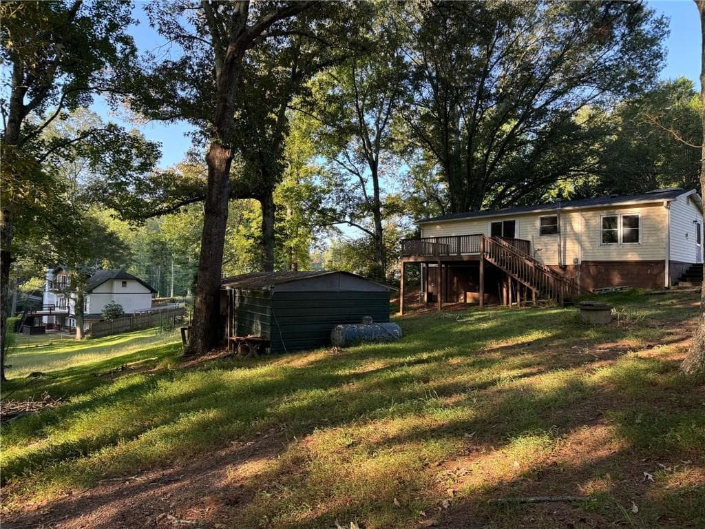 2 bedroom, 2 bathroom, 900 sq ft single family residence for sale at 14450 Cogburn Road, Milton, GA 30004 — photo 2