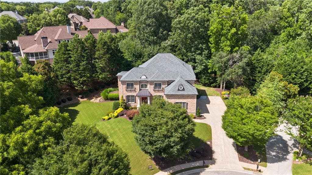 6 bedroom, 5 bathroom, 6,299 sq ft single family residence sold at 4085 Asheville Manor Court, Cumming, GA 30040