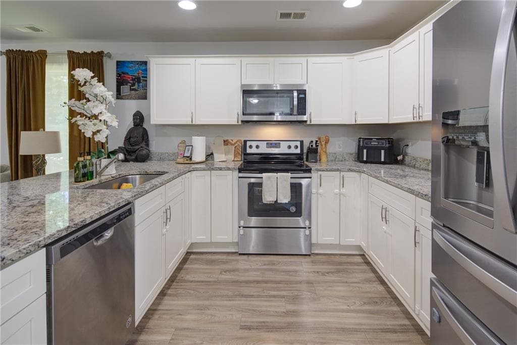 3 bedroom, 3 bathroom, 1,372 sq ft single family residence for sale at 2445 Fleetwood Drive, Cumming, GA 30041 — photo 8