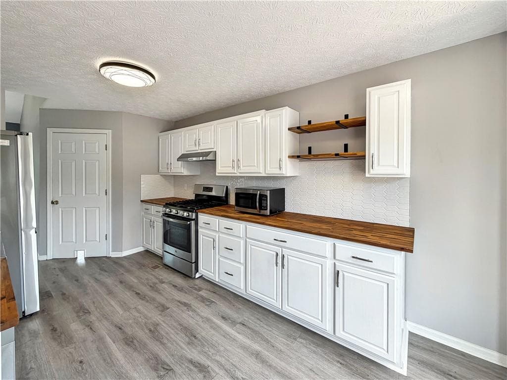 4 bedroom, 3 bathroom, 1,690 sq ft single family residence for sale at 4772 Pastry Lane, Acworth, GA 30101 — photo 7