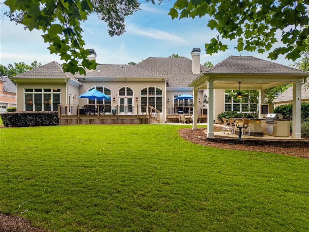4 bedroom, 5 bathroom, 6,109 sq ft single family residence for sale at 7135 Sheffield Place, Cumming, GA 30040 — photo 2