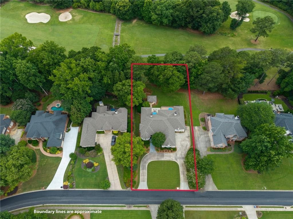 4 bedroom, 5 bathroom, 6,109 sq ft single family residence for sale at 7135 Sheffield Place, Cumming, GA 30040 — photo 4