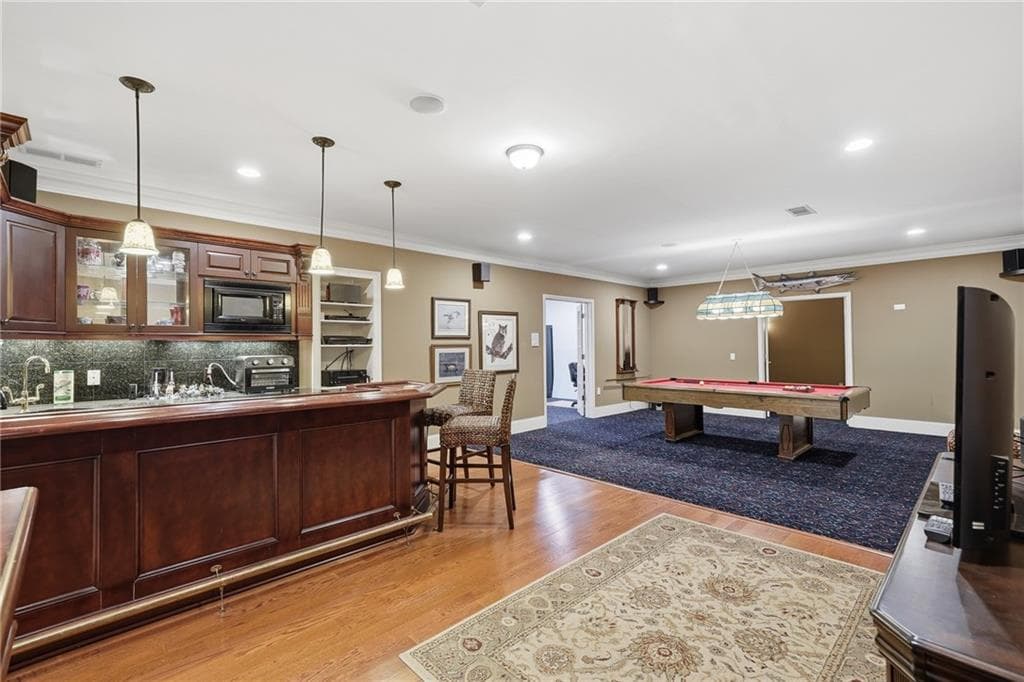 4 bedroom, 5 bathroom, 6,109 sq ft single family residence for sale at 7135 Sheffield Place, Cumming, GA 30040 — photo 8