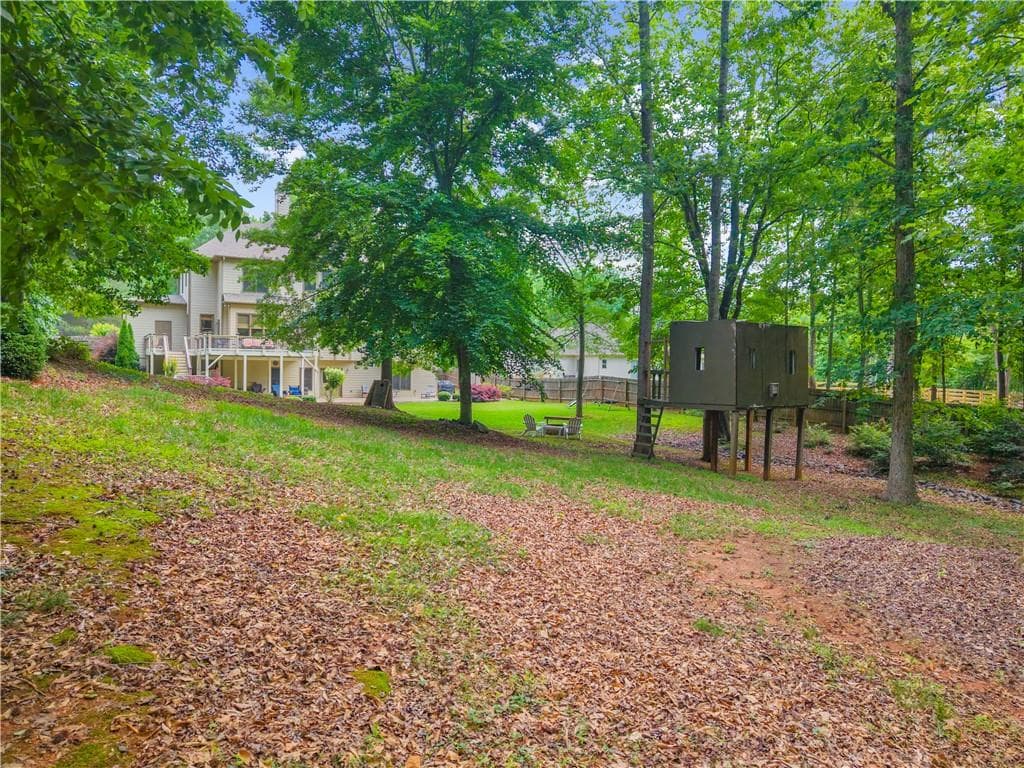 6 bedroom, 5 bathroom, 5,584 sq ft single family residence for sale at 7530 Wandering Oak Way, Cumming, GA 30041 — photo 4