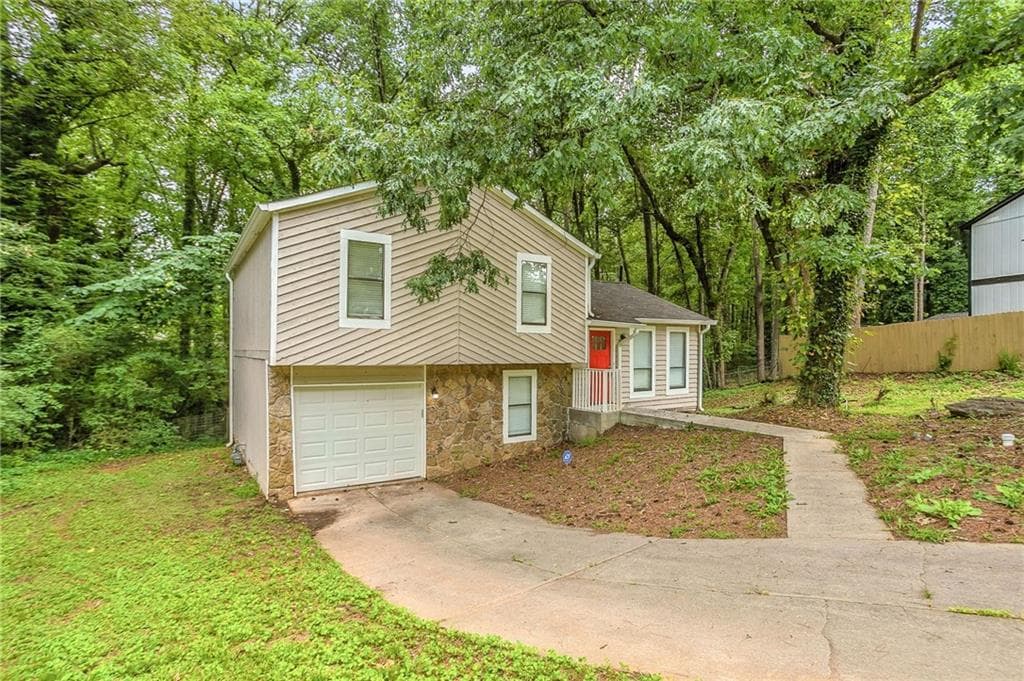 4 bedroom, 2 bathroom, 1,448 sq ft single family residence for sale at 4645 Hairston Crossing Place, Stone Mountain, GA 30083 — photo 2