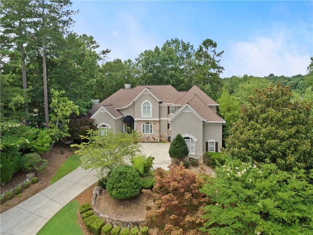 7 bedroom, 5 bathroom, 8,582 sq ft single family residence sold at 205 Wicklawn Way, Roswell, GA 30076
