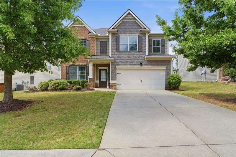 5 bedroom, 4 bathroom, 3,142 sq ft single family residence for sale at 5750 Palmtree Pass, Cumming, GA 30040 — photo 2