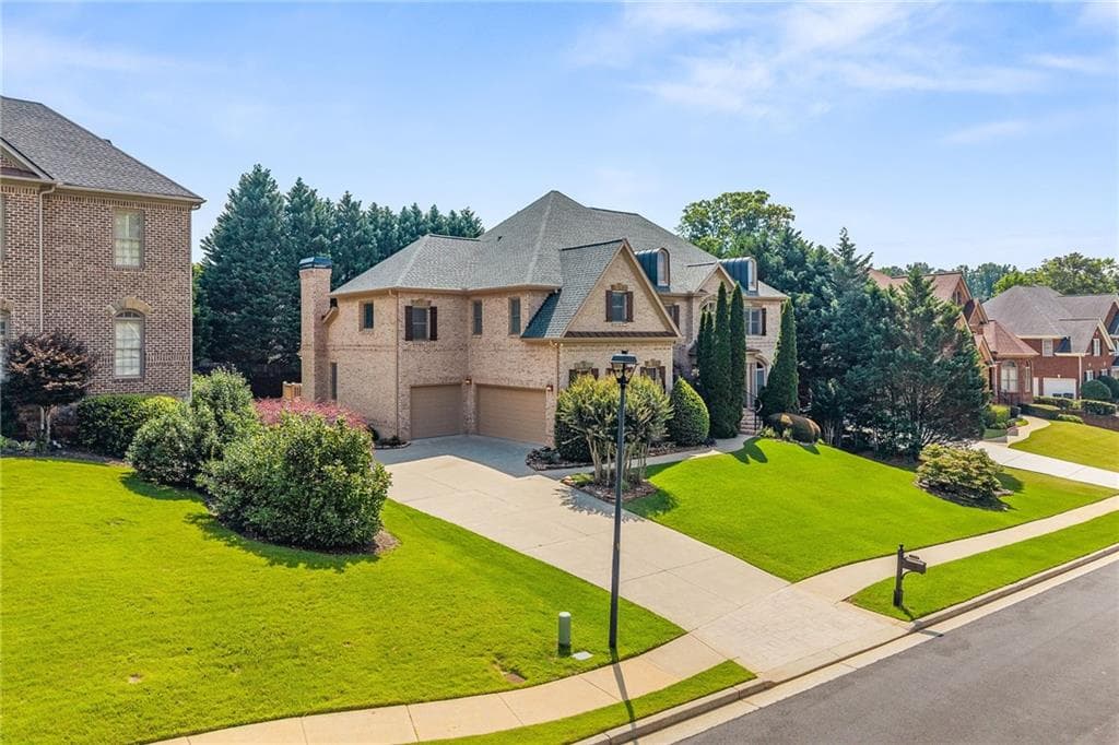 6 bedroom, 7 bathroom, 7,675 sq ft single family residence for sale at 2122 Hunters Green Drive, Lawrenceville, GA 30043 — photo 2
