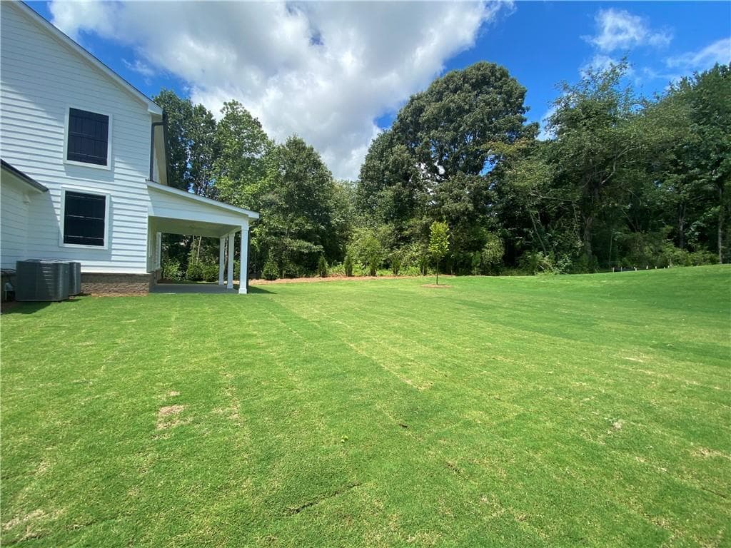 5 bedroom, 4 bathroom, 3,688 sq ft single family residence for sale at 4620 Cogburn Path, Cumming, GA 30028 — photo 2