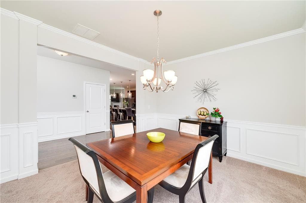 6 bedroom, 4 bathroom, 3,776 sq ft single family residence for sale at 5410 Whisper Court, Cumming, GA 30028 — photo 6
