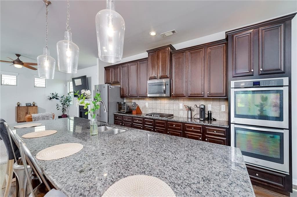 6 bedroom, 4 bathroom, 3,776 sq ft single family residence for sale at 5410 Whisper Court, Cumming, GA 30028 — photo 8
