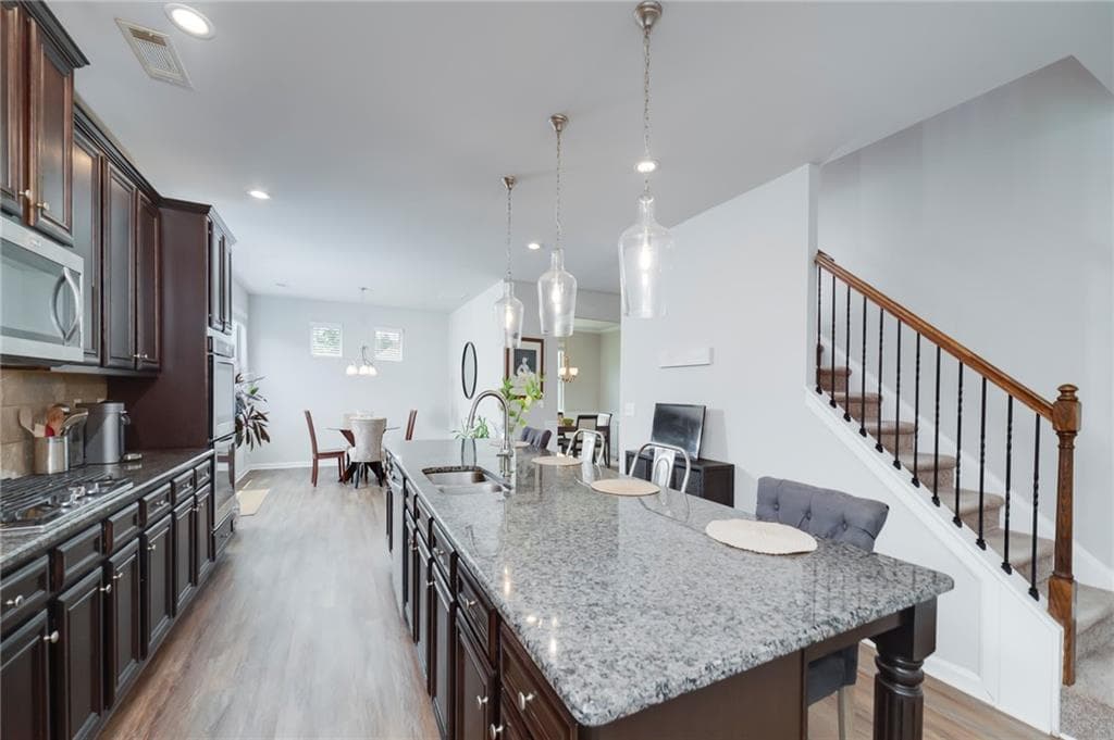 6 bedroom, 4 bathroom, 3,776 sq ft single family residence for sale at 5410 Whisper Court, Cumming, GA 30028 — photo 10