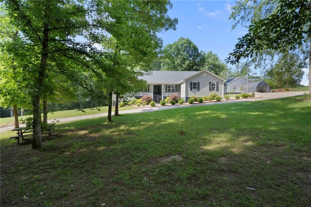 4 bedroom, 2 bathroom, 2,612 sq ft single family residence for sale at 2502 Flat Shoals Road, Conyers, GA 30094 — photo 2