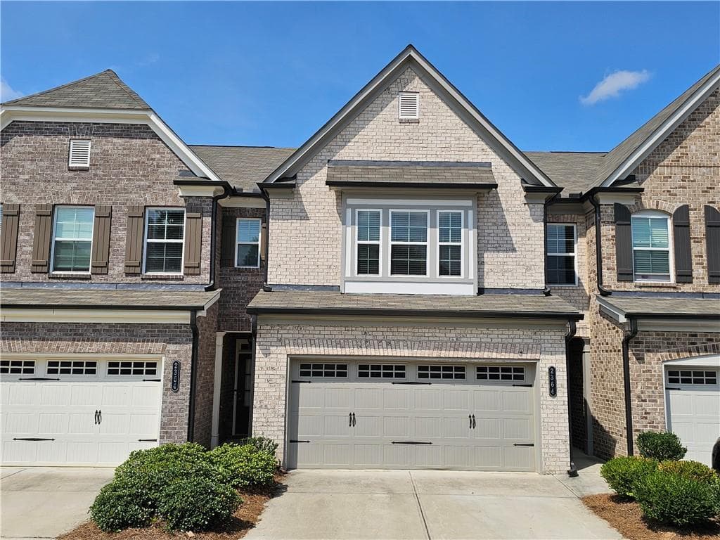 3 bedroom, 3 bathroom, 1,918 sq ft townhouse for sale at 2364 Morgan Place Drive, Buford, GA 30519 — photo 1 of 34