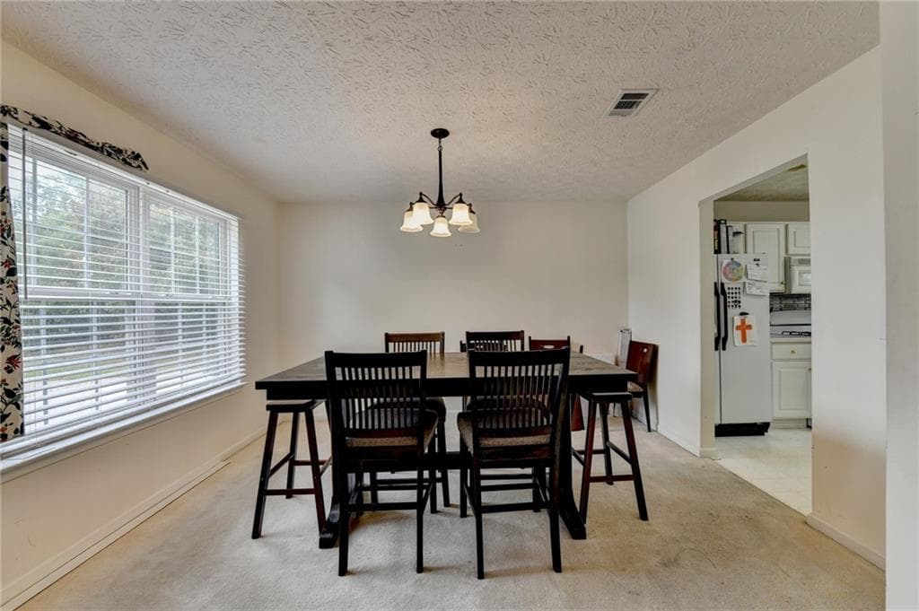 4 bedroom, 3 bathroom, 2,491 sq ft single family residence for sale at 3012 River Garden Road, Covington, GA 30016 — photo 6