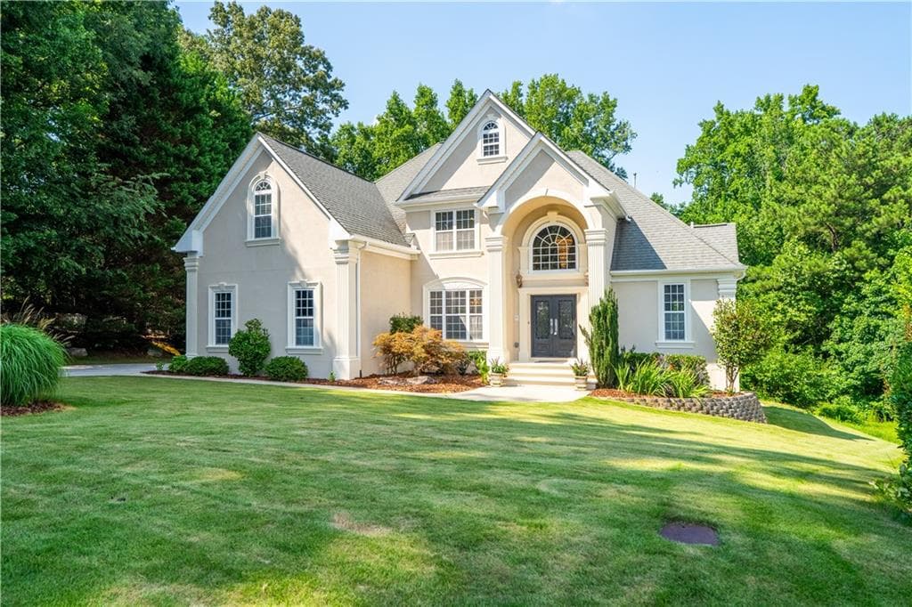 7 bedroom, 5 bathroom, 5,038 sq ft single family residence sold at 911 Woodward Park Drive, Suwanee, GA 30024