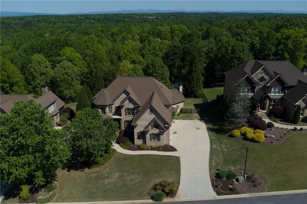 6 bedroom, 5 bathroom, 6,391 sq ft single family residence for sale at 5940 Boulder Bluff Drive, Cumming, GA 30040 — photo 4