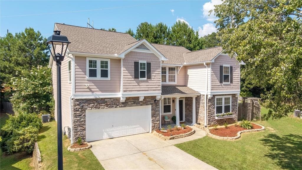 4 bedroom, 3 bathroom, 3,457 sq ft single family residence for sale at 6261 Sparkling Cove Lane, Buford, GA 30518 — photo 2