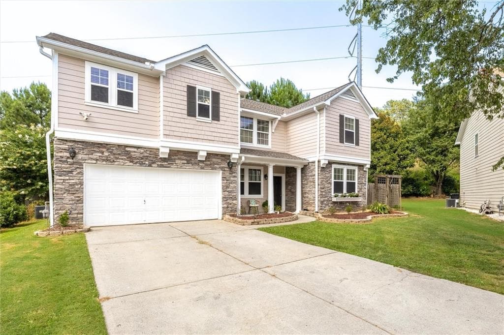 4 bedroom, 3 bathroom, 3,457 sq ft single family residence for sale at 6261 Sparkling Cove Lane, Buford, GA 30518 — photo 4