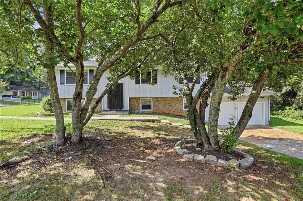 5 bedroom, 3 bathroom, 2,142 sq ft single family residence for sale at 6047 Marbut Road, Lithonia, GA 30058 — photo 1 of 35