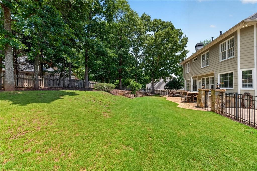 6 bedroom, 5 bathroom, 4,800 sq ft single family residence for sale at 5490 Hampstead Way, Johns Creek, GA 30097 — photo 4