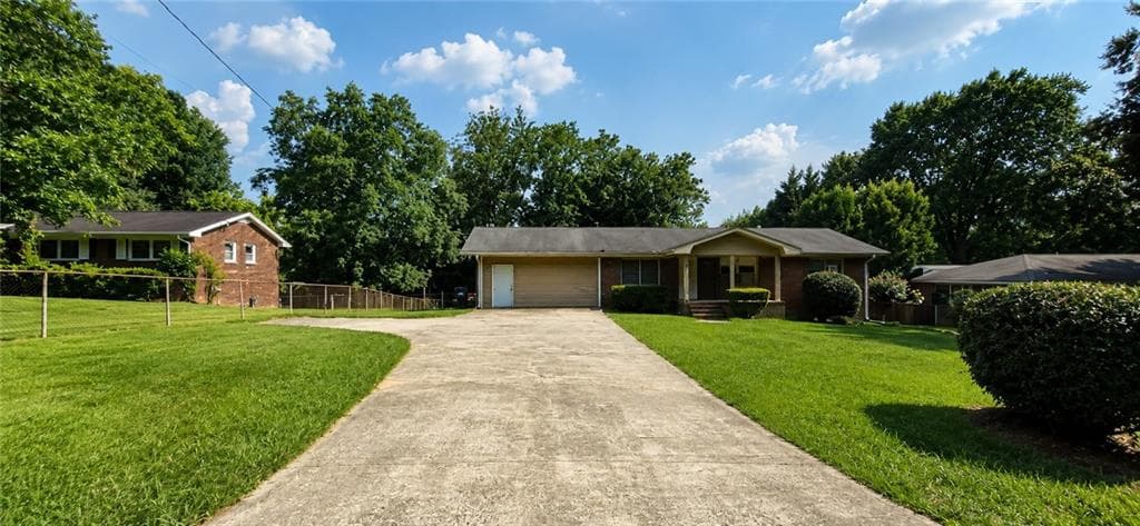 4 bedroom, 2 bathroom, 1,382 sq ft single family residence for sale at 1156 E Fayetteville Road, Riverdale, GA 30296 — photo 2