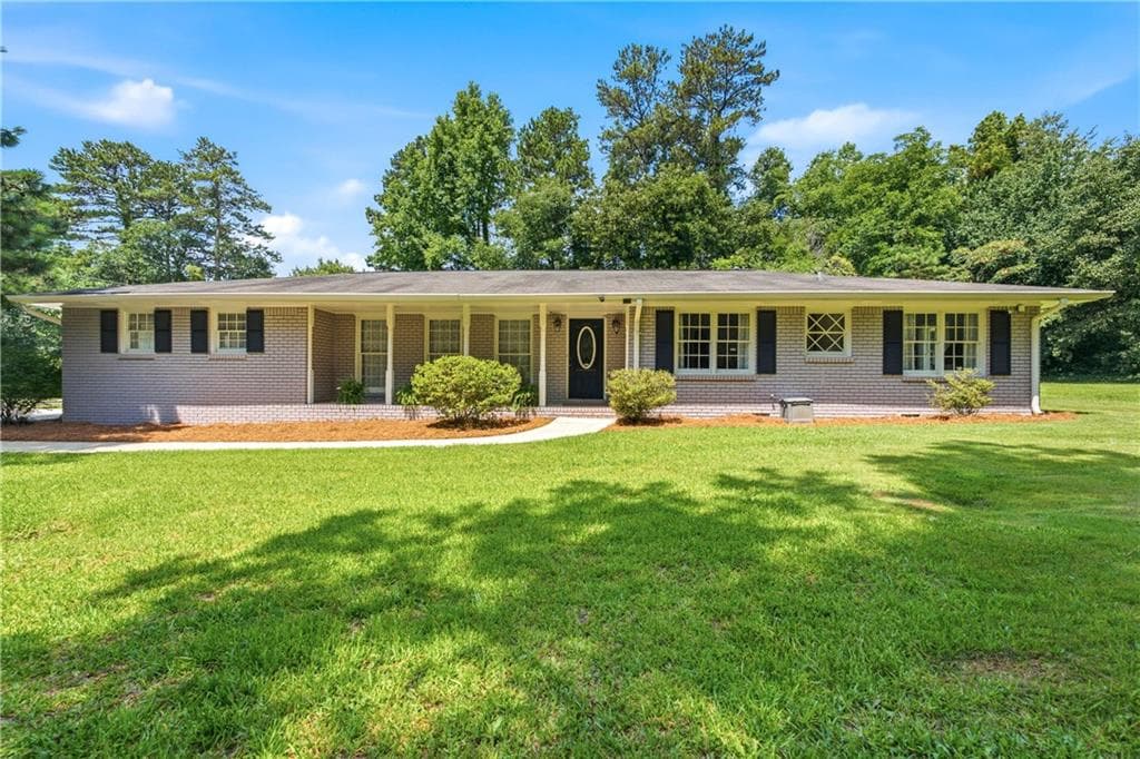4 bedroom, 3 bathroom, 1,957 sq ft single family residence for sale at 2447 Lenora Church Road, Snellville, GA 30078 — photo 1 of 25