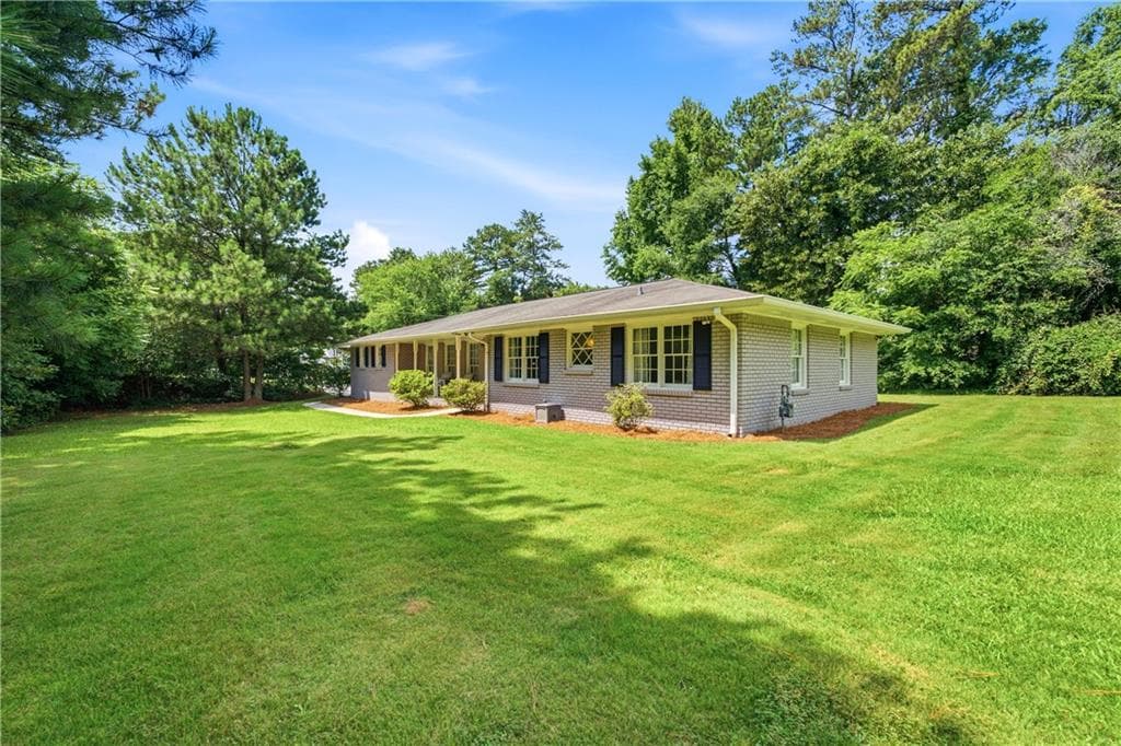 4 bedroom, 3 bathroom, 1,957 sq ft single family residence for sale at 2447 Lenora Church Road, Snellville, GA 30078 — photo 2