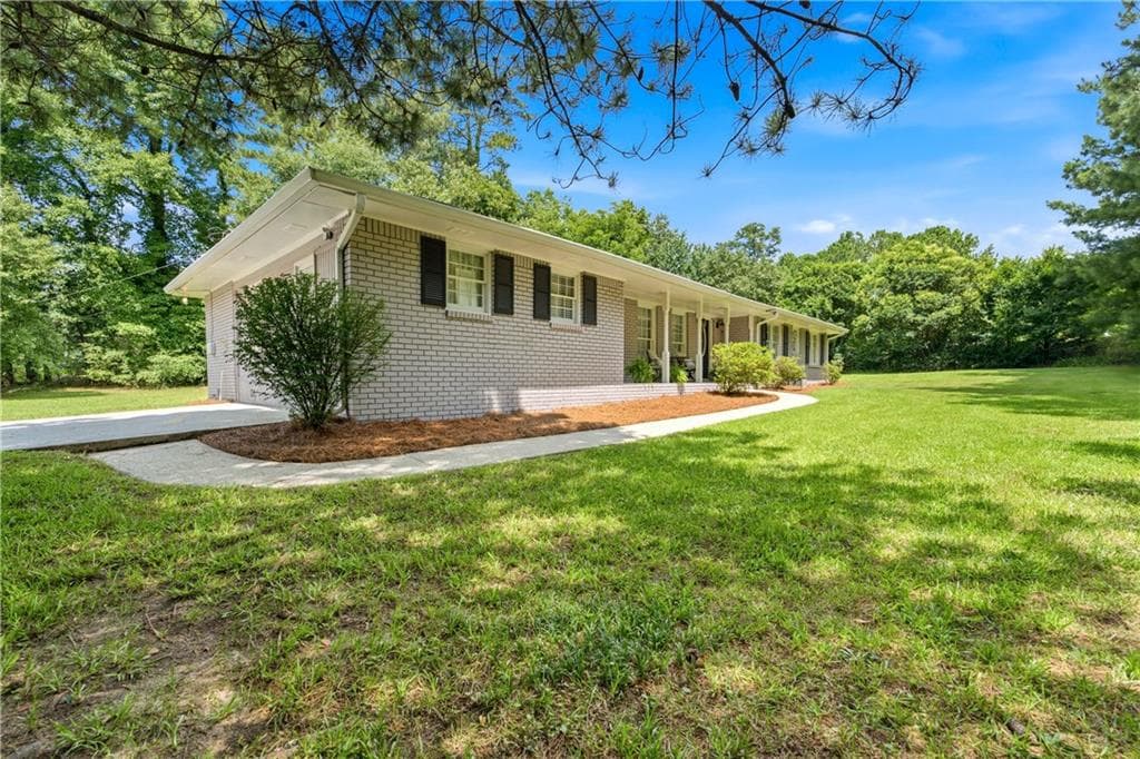 4 bedroom, 3 bathroom, 1,957 sq ft single family residence for sale at 2447 Lenora Church Road, Snellville, GA 30078 — photo 3