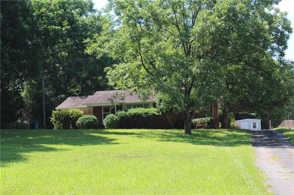 3 bedroom, 1 bathroom, 1,148 sq ft single family residence for rent at 1115 W Spring Street, Monroe, GA 30655 for $1,400 a month — photo 1 of 6