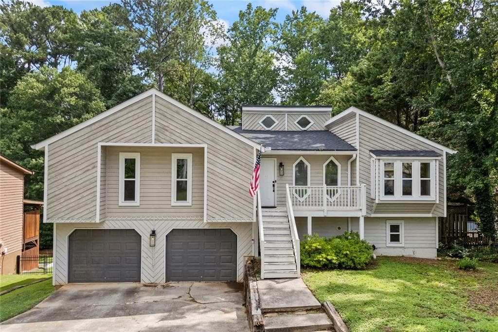 4 bedroom, 3 bathroom, 3,018 sq ft single family residence for sale at 410 Saint Simons Cove, Lawrenceville, GA 30044 — photo 1 of 40