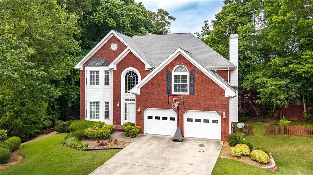 6 bedroom, 4 bathroom, 4,043 sq ft single family residence for sale at 1918 De Winton Place, Lawrenceville, GA 30043 — photo 2