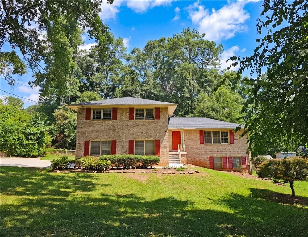 5 bedroom, 4 bathroom, 2,218 sq ft single family residence for sale at 4828 Scotland Drive, Stone Mountain, GA 30088 — photo 1 of 36