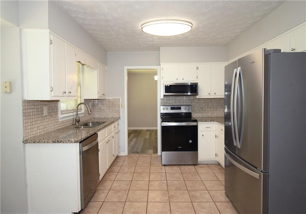 5 bedroom, 4 bathroom, 2,218 sq ft single family residence for sale at 4828 Scotland Drive, Stone Mountain, GA 30088 — photo 9