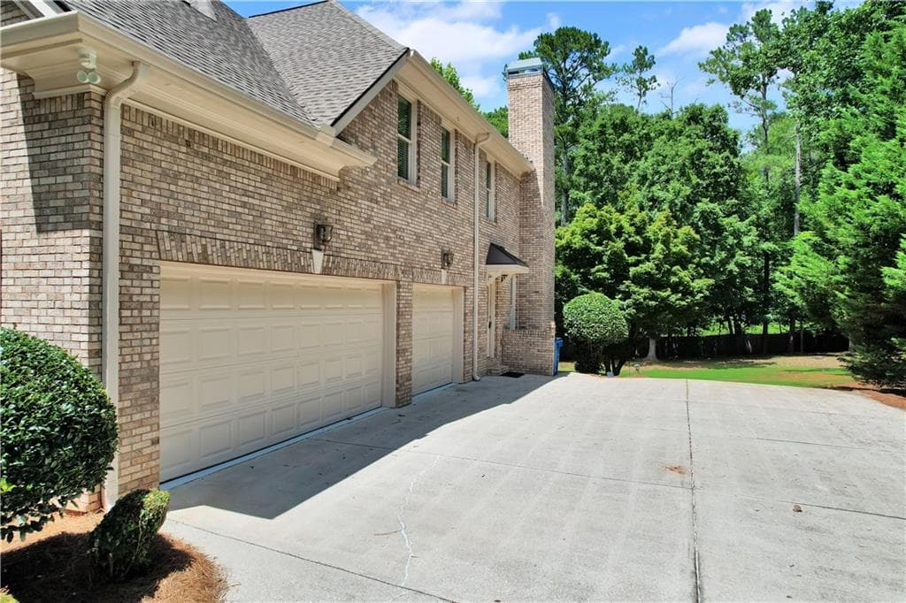 5 bedroom, 4 bathroom, 4,246 sq ft single family residence for sale at 1020 Cranbrook Glen Lane, Snellville, GA 30078 — photo 2