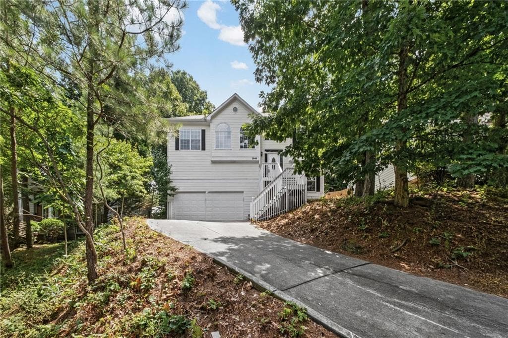 4 bedroom, 3 bathroom, 2,420 sq ft single family residence for sale at 2646 Mcguire Drive, Kennesaw, GA 30144 — photo 2