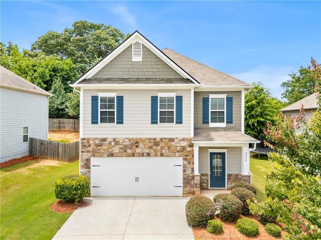 5 bedroom, 3 bathroom, 2,368 sq ft single family residence for sale at 4335 Huron Drive, Cumming, GA 30028 — photo 2