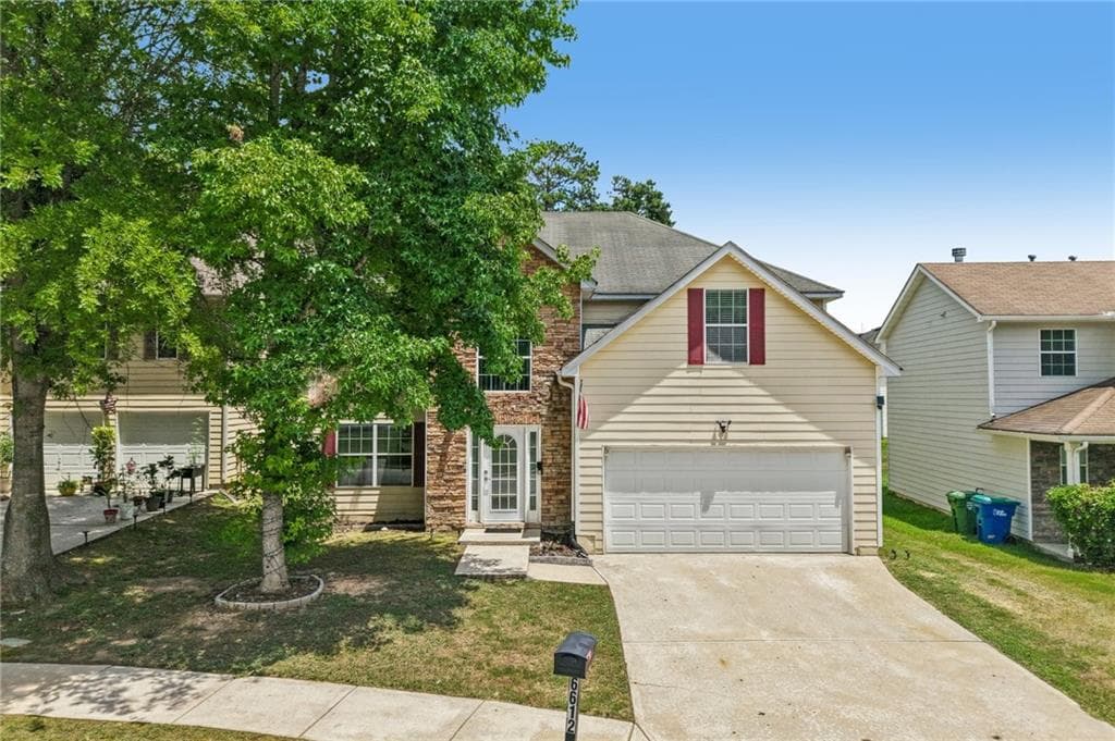 4 bedroom, 3 bathroom, 2,631 sq ft single family residence for sale at 6612 Pamplona Place, Atlanta, GA 30349 — photo 2